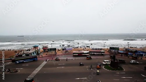 Pan shot of traffic moving on the Beach Road at Ramakrishna Beach, Visakhapatnam, Andhra Pradesh, India