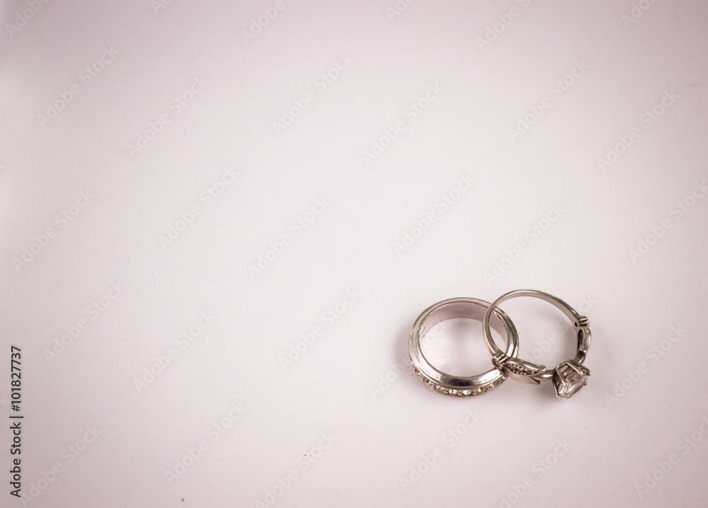two silver engagement rings with diamonds, closeup two silver engagement rings with diamonds, closeup