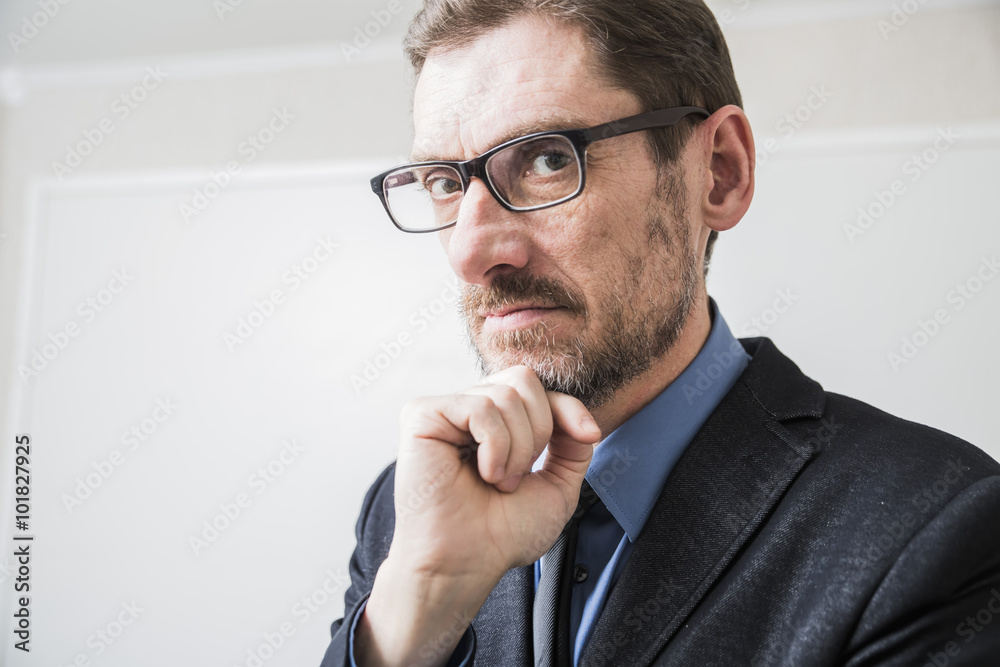 closeup portrait a grown man dressed in a jacket and tie and glasses looking at viewer closeup portrait a grown man dressed in a jacket and tie and glasses looking at viewer