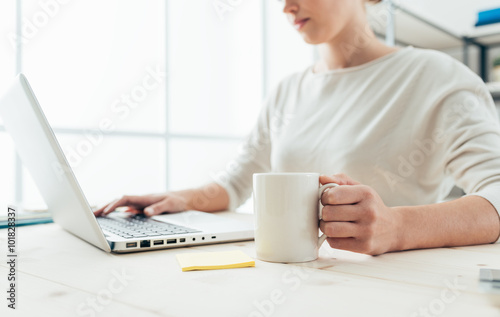 Woman having a coffee break and networking