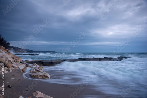 Beauty long exposure cloudy seascape at the Black Sea coast, Bulgaria with stones and rocks © EdVal