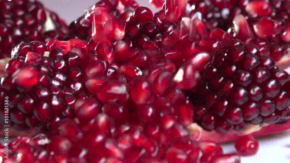 Garnet. Fresh pomegranate seeds falling.  Slow motion 240 fps. 