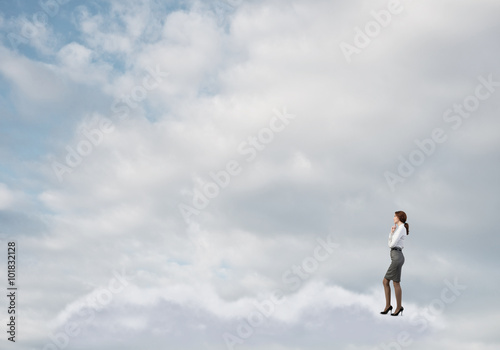 Businesswoman on white cloud 