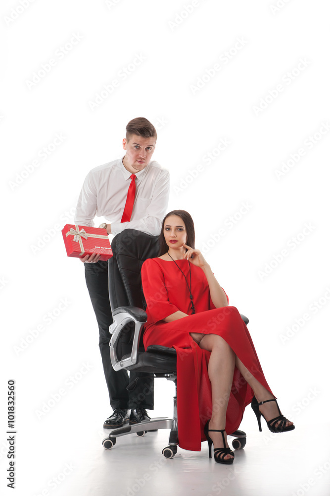 couple in love on a white background with a gift couple in love on a white background with a gift