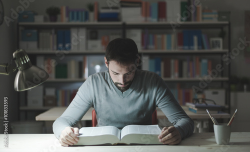Smart man studying at night