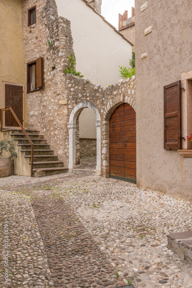 Fototapeta premium Entrance of an old apartment building in Malcesine, Italy.