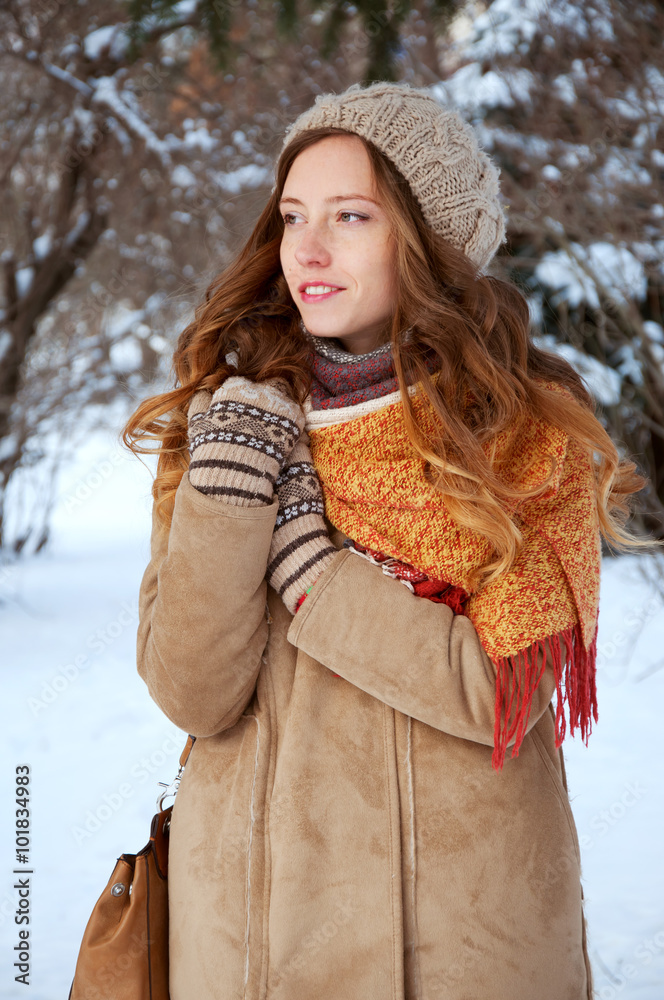 Cute redhead girl in winter coat outdoors Cute redhead girl in winter coat outdoors
