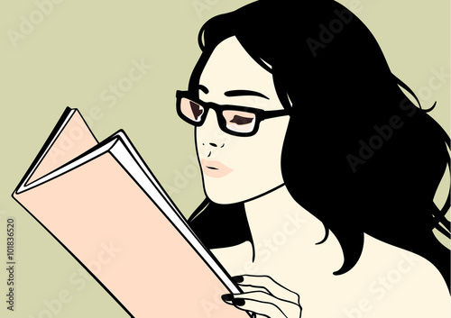 Beautiful brunette girl in glasses reading a book