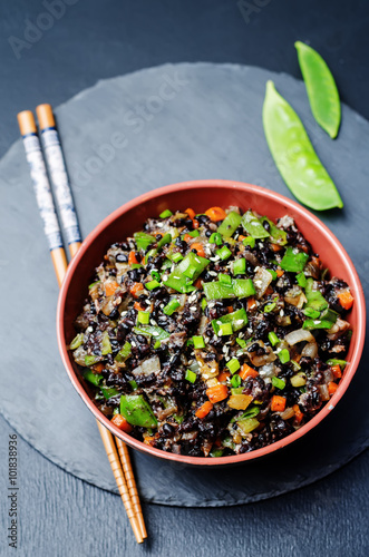 Black rice with snap peas and vegetables photo