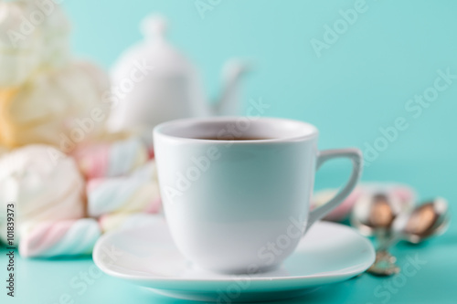 Coffee cup and pile sweet pastel colored marshmall photo