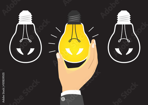 glowing yellow light bulb after being turned on