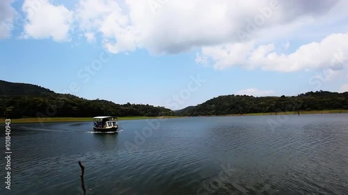 Shot of a tour boat moving in a lake, Periyar Lake, Thekkady, Kerala, India