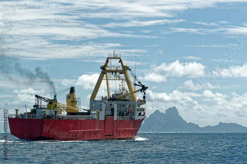 Cargo ship going to Bora Bora/Small cargo ship on the blue sea going to Bora Bora