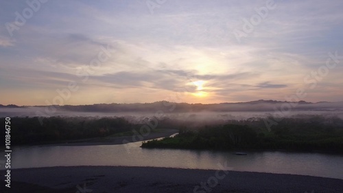 Flight over amazon at sunrise