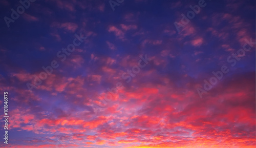 delightful fire pocked sky at sunset with sun rays © Lumppini