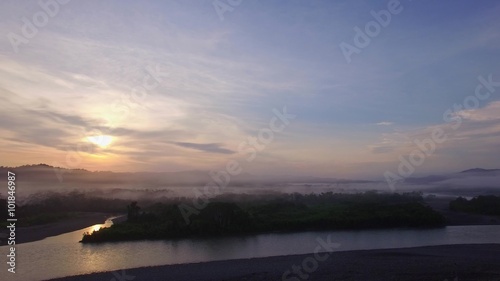 Flight over amazon at sunrise