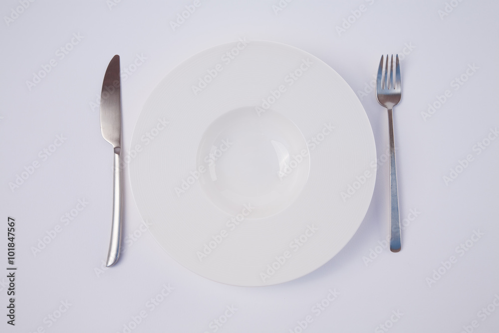 empty white dish and cutlery