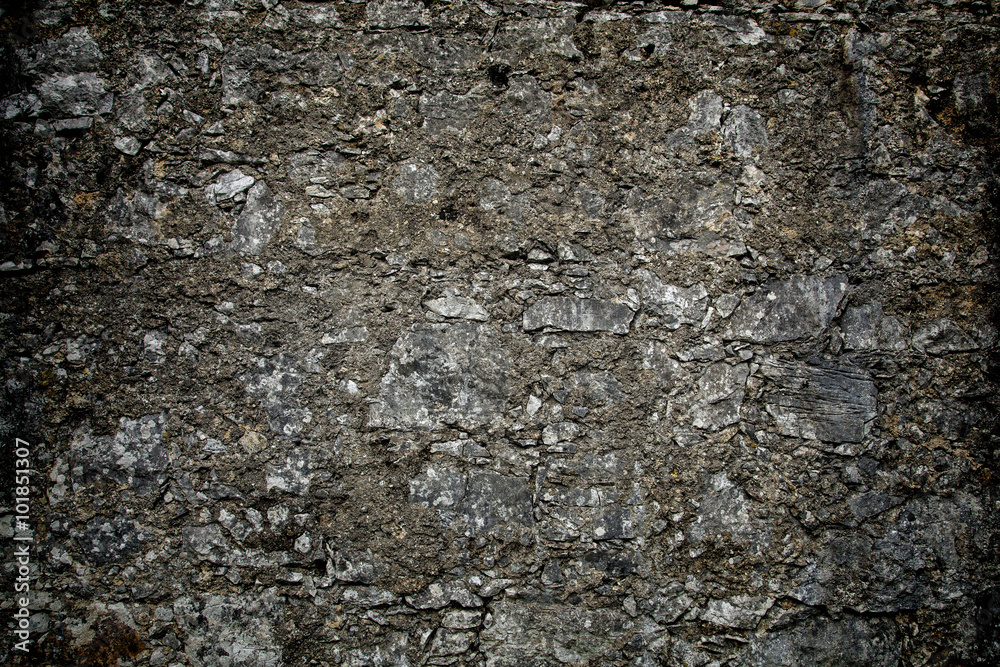 Grey textured stone wall with vignette effect