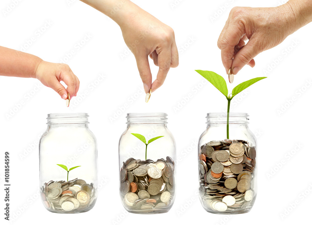 Φωτογραφία family member putting a golden coin to  young green plants growing in glass bott