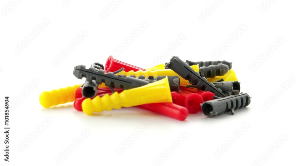 Closeup of colorful plastic dowels isolated on white background. Closeup of colorful plastic dowels isolated on white background.