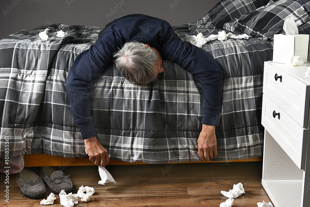 Foto Sick Man Lying Across Bed