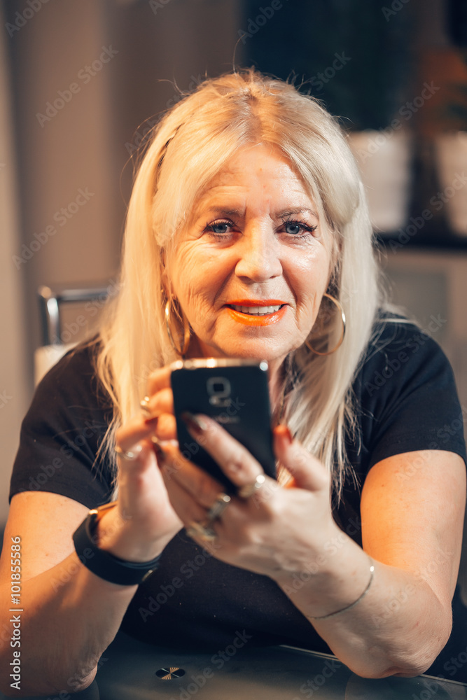 Fotografie Old woman touch smartphone