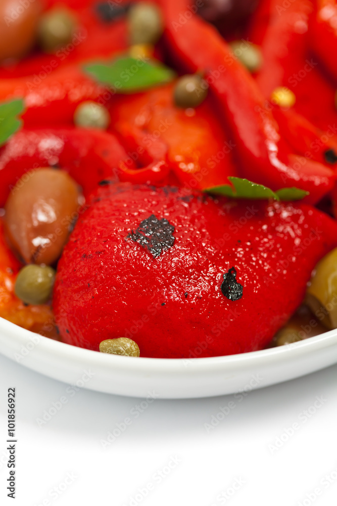 Roasted Red Pepper Salad on white background. Selective focus. Roasted Red Pepper Salad on white background. Selective focus.