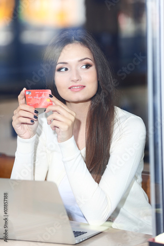 Young woman working with la...