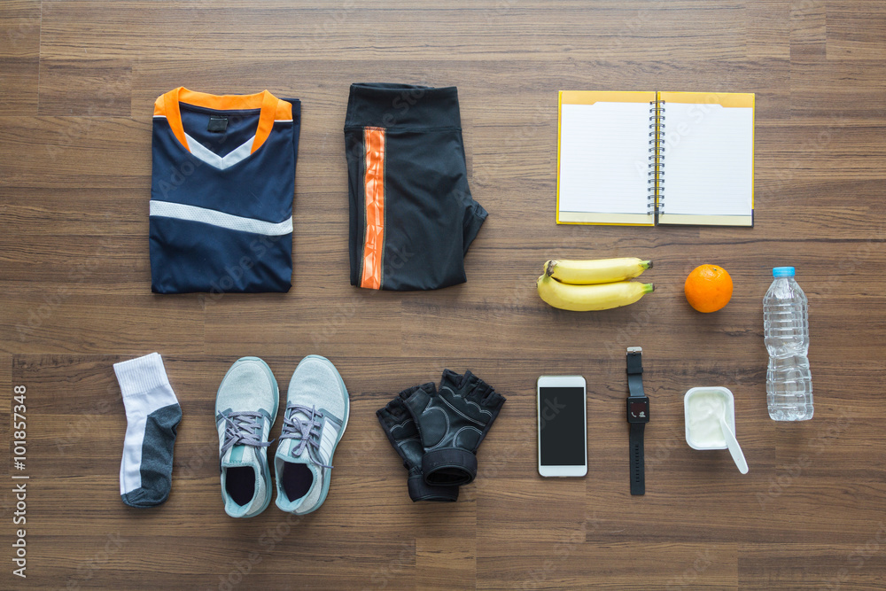 Sport clothes and accessories on a wooden background Sport clothes and accessories on a wooden background