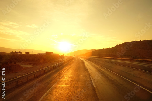 Beautiful golden sunrise over the road