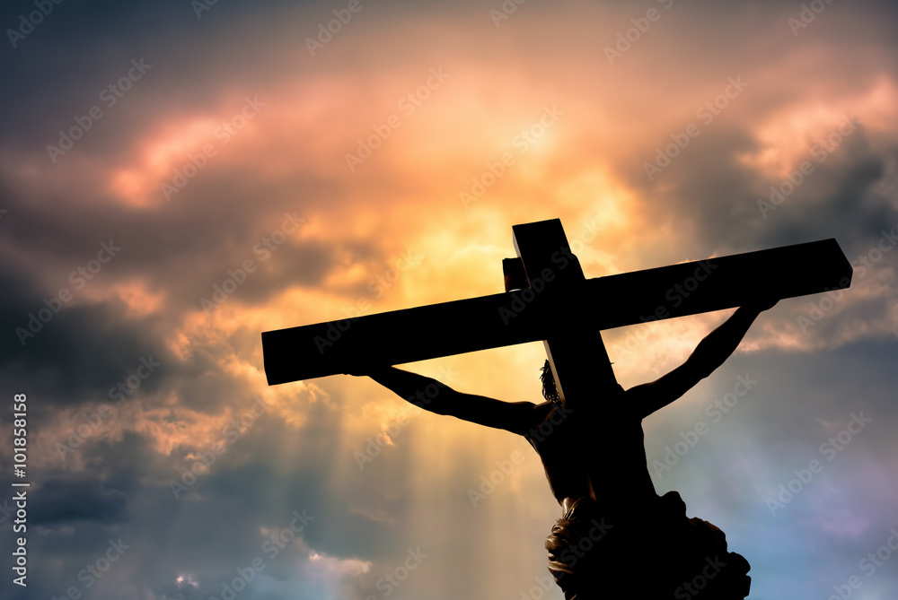 Φωτογραφία Christian cross with Jesus Christ statue over stormy clouds