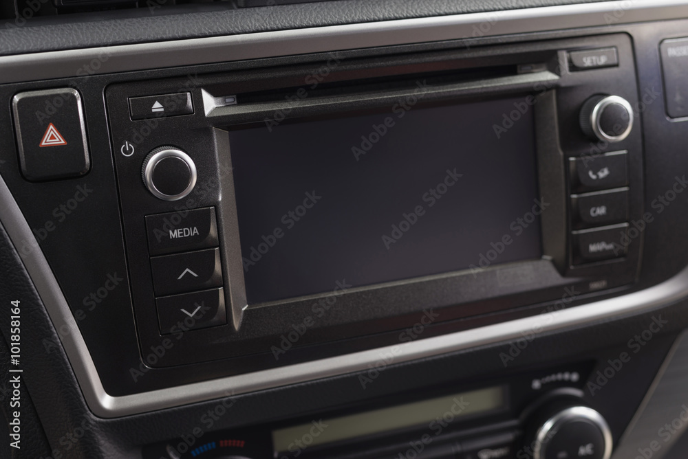 Fototapeta premium Modern car dashboard. Multimedia control buttons. Interior detail.