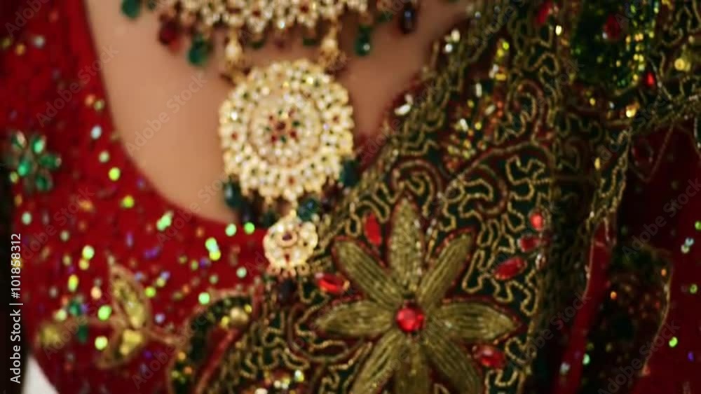 Tilt up shot of a Indian bride smiling and posing Tilt up shot of a Indian bride smiling and posing