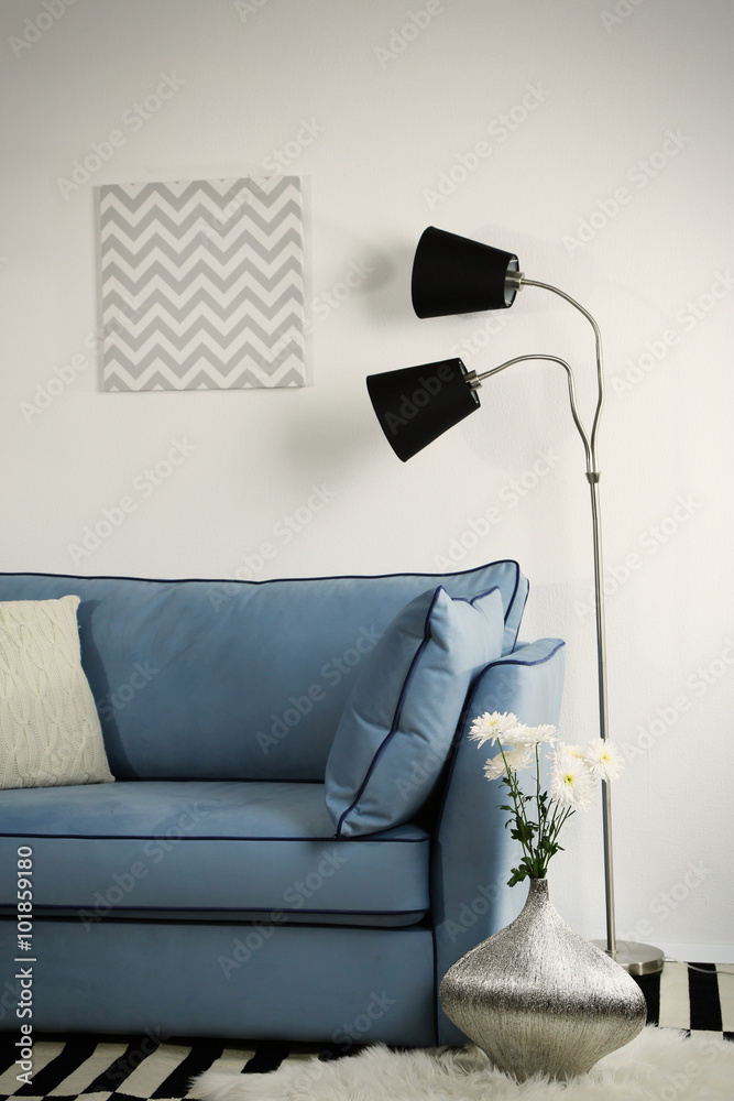 Beautiful modern living room with blue sofa and floor lamp Stock Photo ...