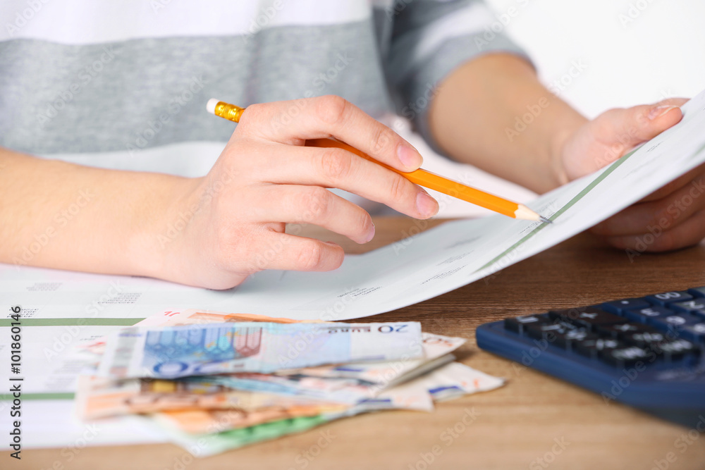 Man working on financial report at the office, close-up Man working on financial report at the office, close-up