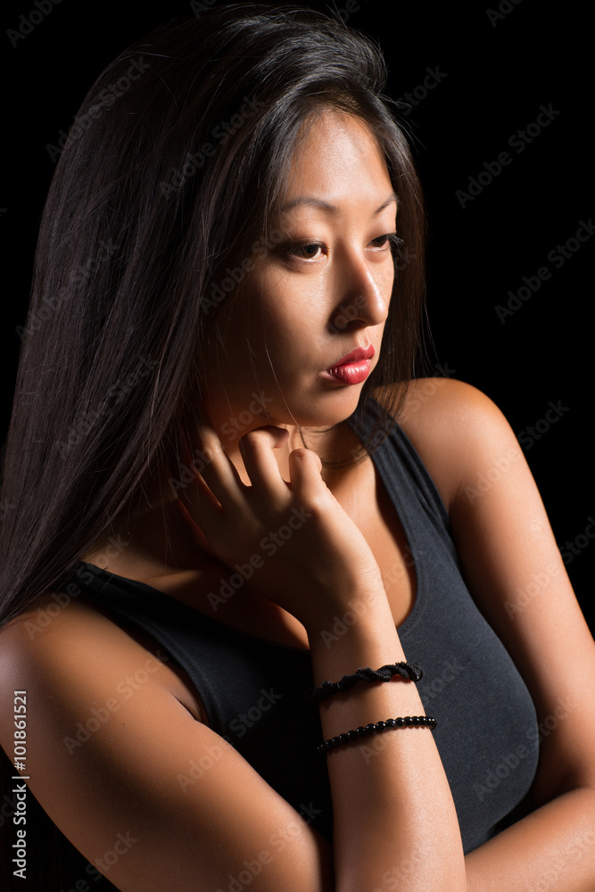 Beautiful Asian girl in a black t-shirt Beautiful Asian girl in a black t-shirt
