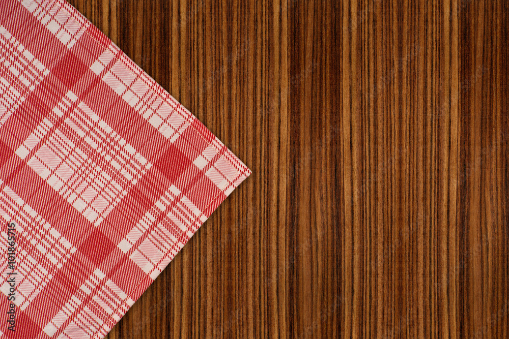 the checkered tablecloth on wooden table the checkered tablecloth on wooden table