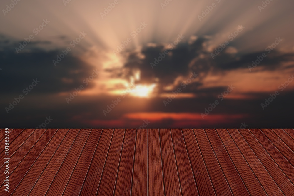 Empty wooden table and beautiful summer sunset in background. Gr