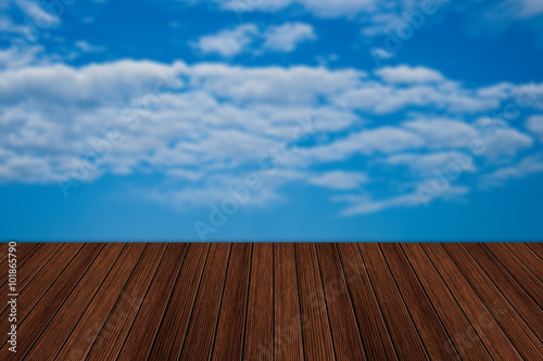 Empty wooden table and beautiful summer sky in background. Great