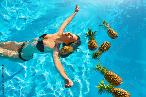 Healthy Diet  Nutrition. Woman With Pineapples In Pool   Water  