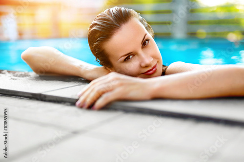Summer Travel Vacation. Woman Relaxing In Pool. Healthy Lifestyl photo