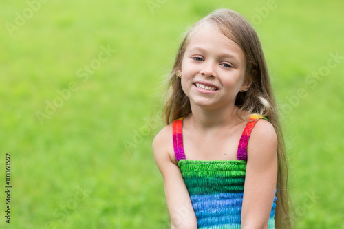Wonderful girl sitting on the lawn