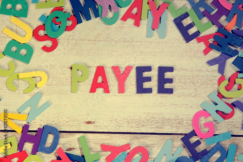 payee word block concept photo on plank wood photo