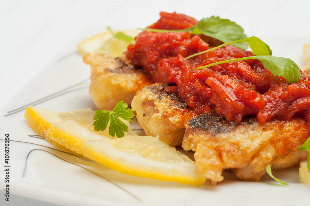 Pieces of fried fish with vegetable marinade. Pieces of fried fish with vegetable marinade.
