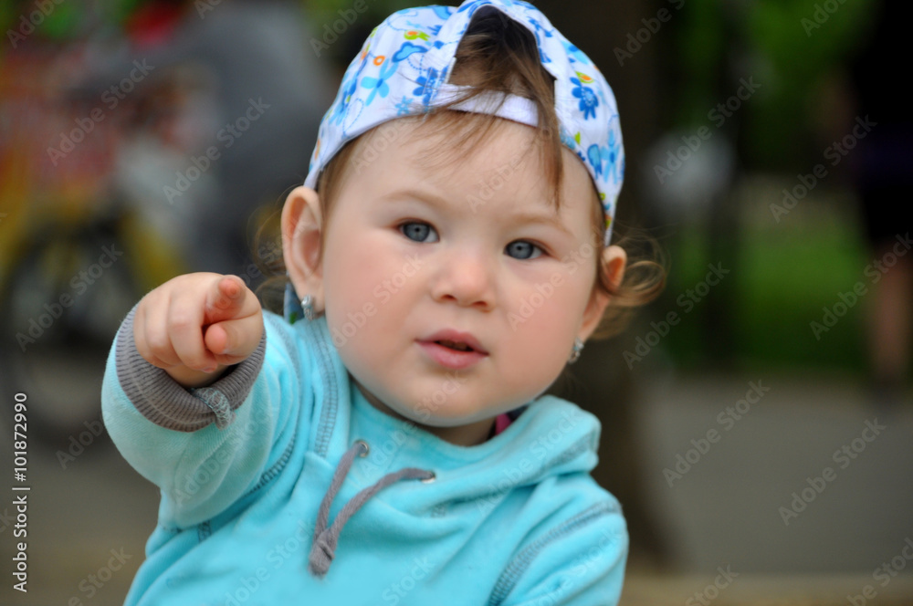 The child, surprised at something shows his hand The child, surprised at something shows his hand