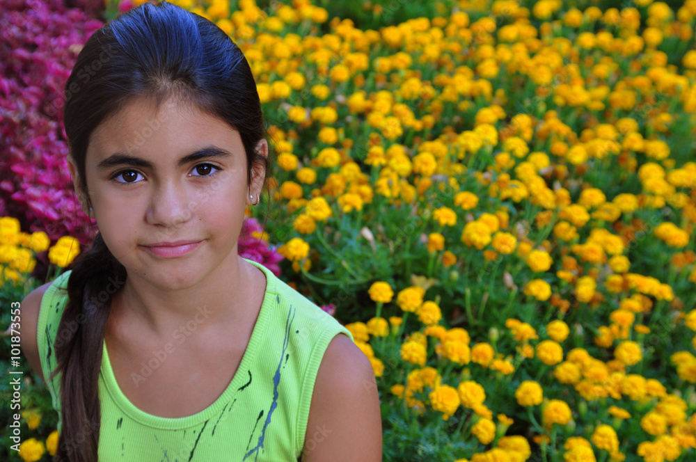 Portrait of a beautiful girl on a background of flowers Portrait of a beautiful girl on a background of flowers