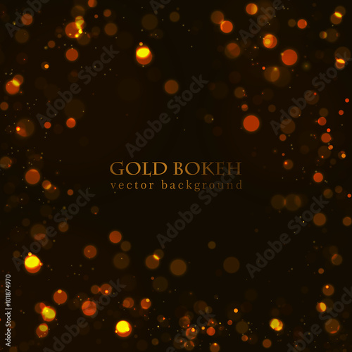 Magic sparkle, gold dots on dark background. Vector bokeh effect. 