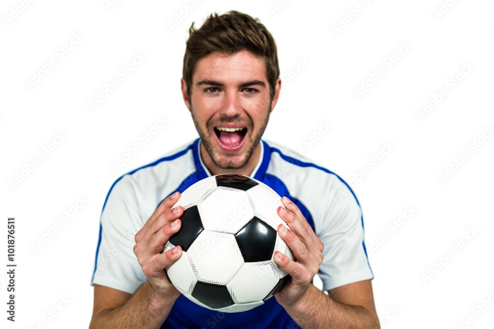 Portrait of man holding football with mouth open Portrait of man holding football with mouth open