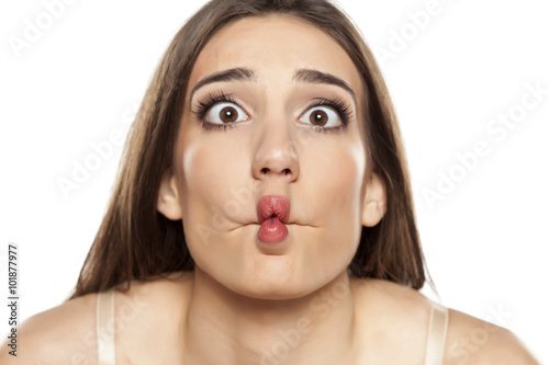 silly young woman making funny faces