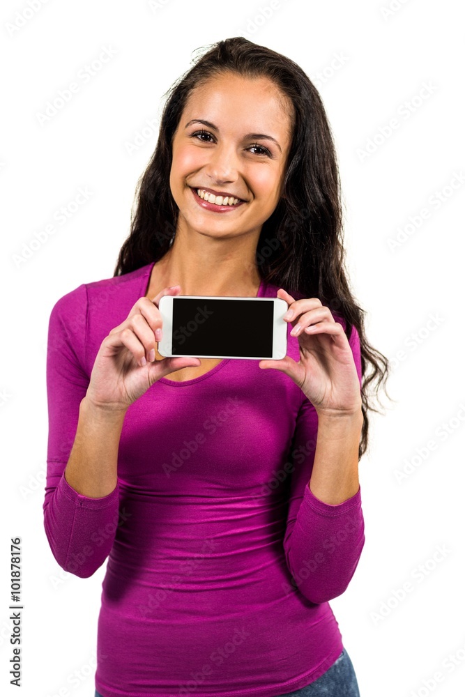 Smiling woman showing smartphone screen at the camera Smiling woman showing smartphone screen at the camera